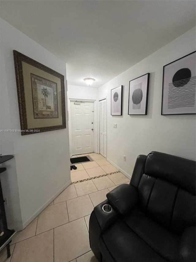 3395 NE 9th St Unit 101, Homestead, FL 33033 - living room featuring baseboards and light tile patterned floors