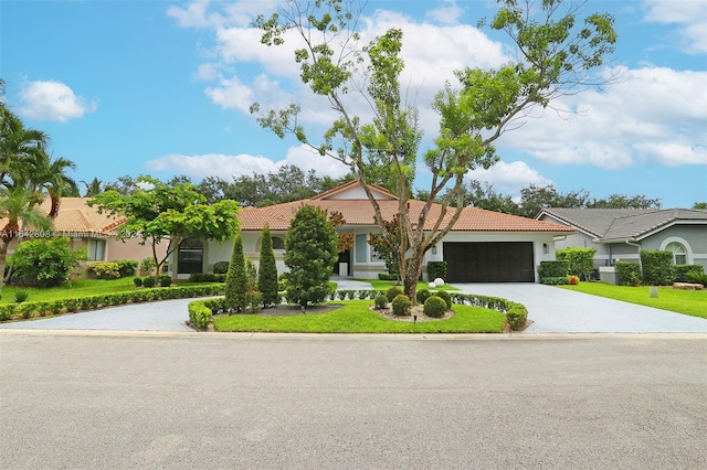 ranch-style home featuring a garage