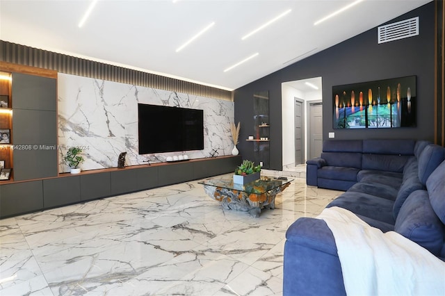 living room featuring vaulted ceiling