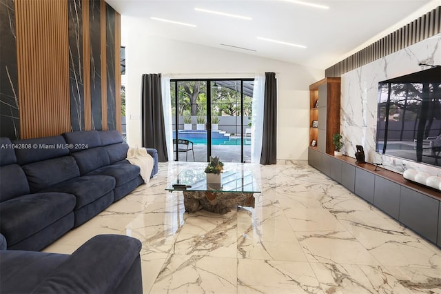 living room featuring lofted ceiling