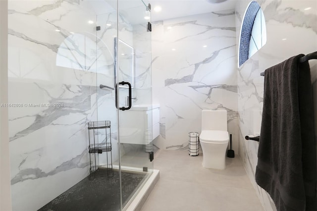 bathroom featuring toilet, walk in shower, and tile walls