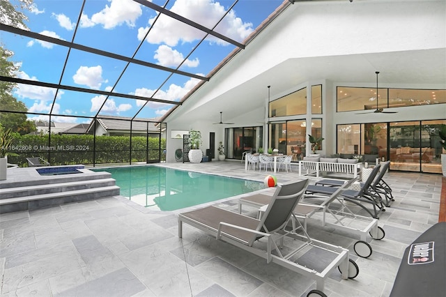 view of pool with a patio, a lanai, an in ground hot tub, and ceiling fan