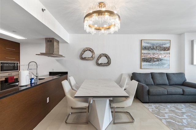 dining area with light tile patterned floors and a chandelier