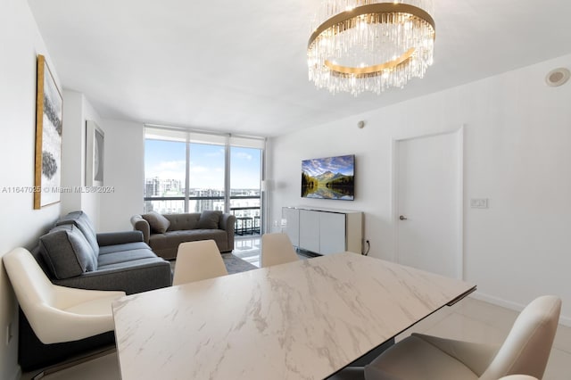 interior space featuring baseboards, floor to ceiling windows, and a notable chandelier