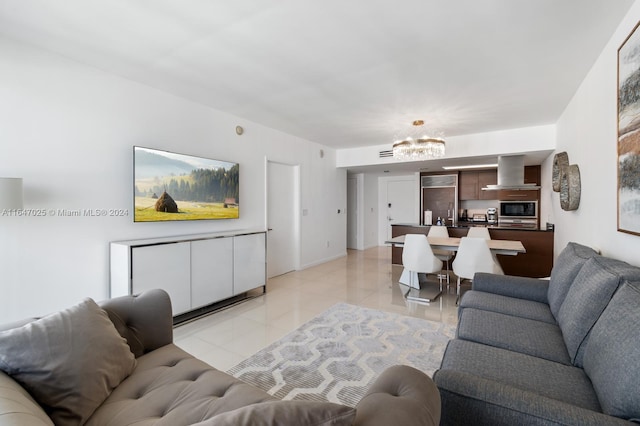 living room featuring light tile patterned floors and a chandelier