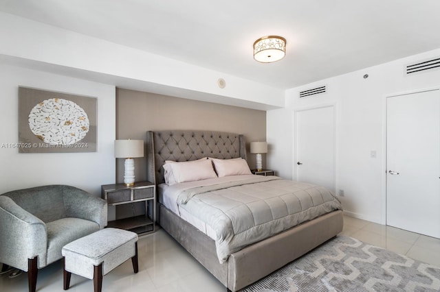 bedroom featuring light tile patterned flooring and visible vents