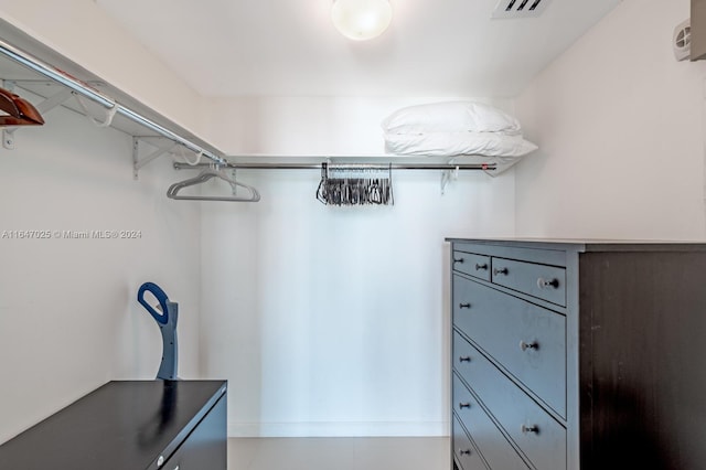 spacious closet featuring visible vents