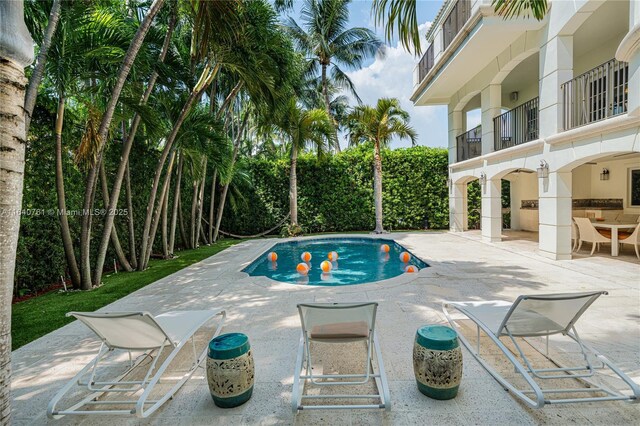 view of pool featuring a patio