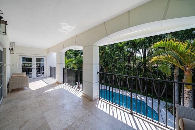 view of patio featuring french doors and a fenced in pool