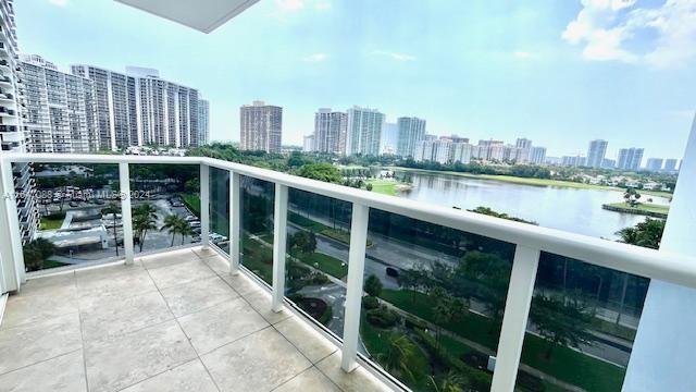 balcony featuring a water view