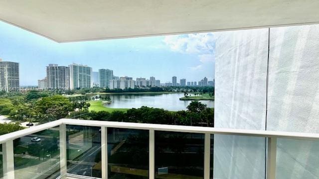 balcony featuring a water view