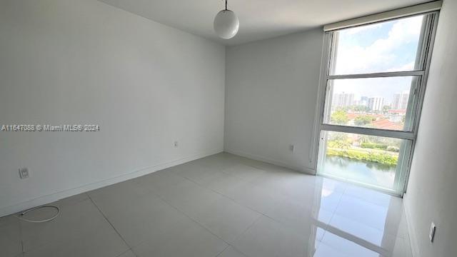 spare room featuring tile patterned floors