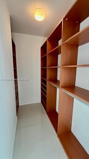 walk in closet featuring tile patterned floors