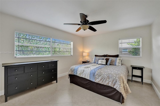 bedroom featuring light tile patterned floors and ceiling fan