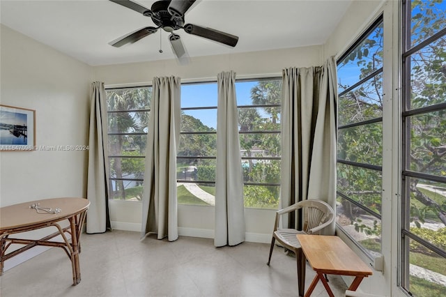 sunroom / solarium with ceiling fan