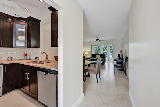 kitchen with light tile patterned flooring, sink, dark brown cabinetry, dishwasher, and ceiling fan