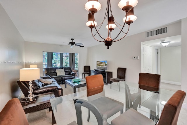 dining room featuring ceiling fan with notable chandelier