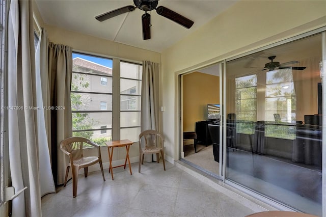 sunroom / solarium with ceiling fan