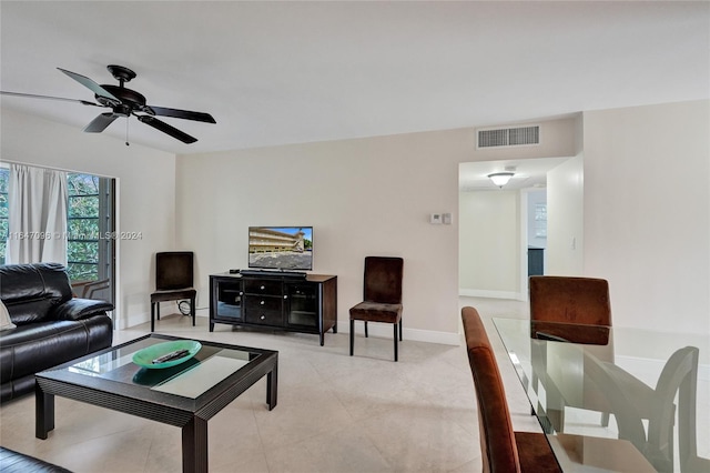 living room with light tile patterned floors and ceiling fan