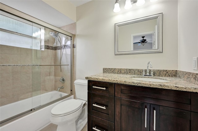 full bathroom with ceiling fan, toilet, vanity, and enclosed tub / shower combo