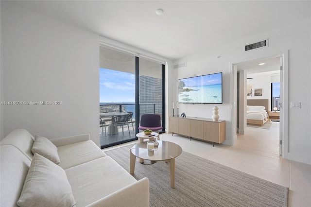 tiled living room with expansive windows