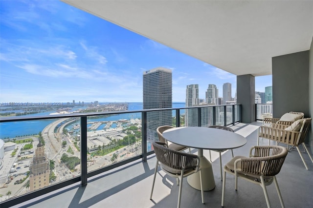 balcony featuring a water view