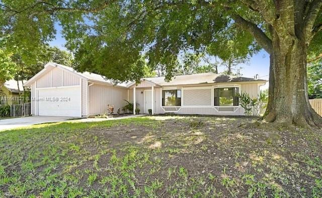 single story home featuring a garage