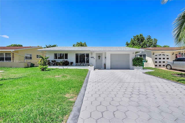 ranch-style house with a garage and a front yard