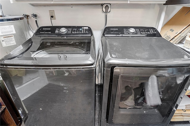 clothes washing area featuring washer and dryer