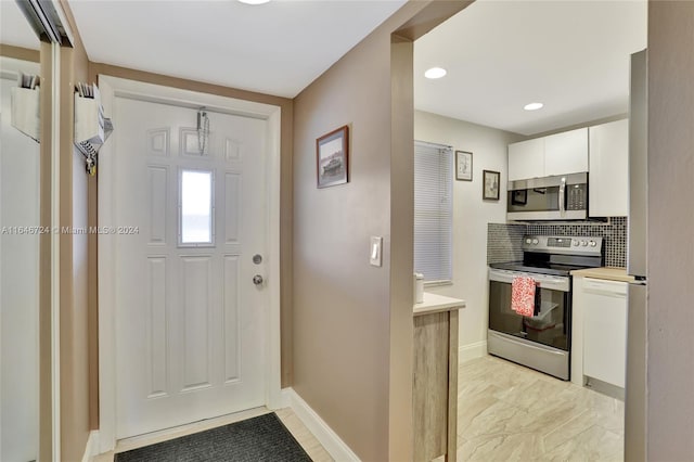 entrance foyer with light tile patterned floors