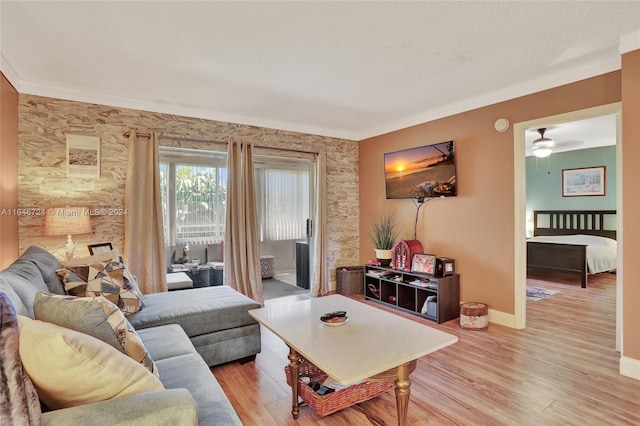 living room featuring light hardwood / wood-style flooring and ceiling fan