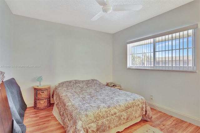 bedroom featuring hardwood / wood-style flooring and ceiling fan