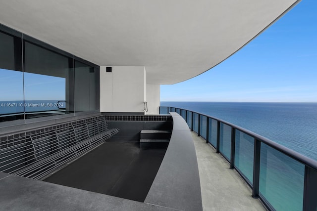 balcony featuring a water view