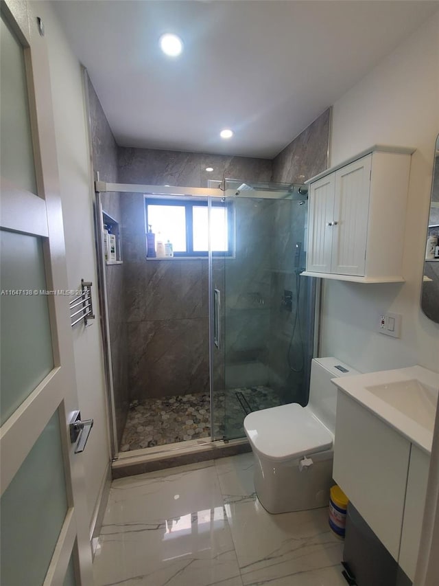 bathroom with a shower with door, toilet, tile patterned floors, and vanity