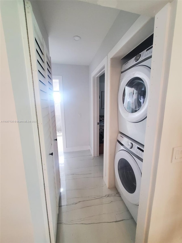 4741 NE 19th Ave, Fort Lauderdale, FL 33308 - washroom with stacked washer and dryer, laundry area, and marble finish floor
