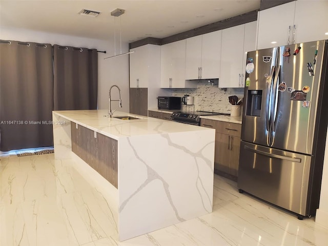 4741 NE 19th Ave, Fort Lauderdale, FL 33308 - kitchen featuring stainless steel appliances, light stone counters, an island with sink, and a sink