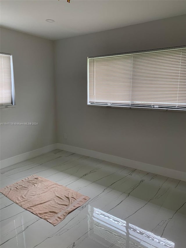 4741 NE 19th Ave, Fort Lauderdale, FL 33308 - unfurnished room with marble finish floor and baseboards