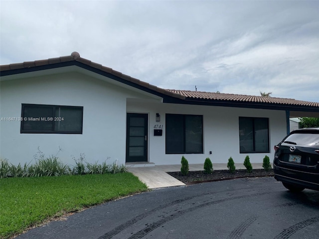 4741 NE 19th Ave, Fort Lauderdale, FL 33308 - single story home with a tile roof and stucco siding