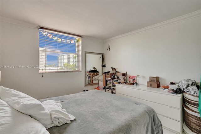 bedroom with light tile patterned floors and ornamental molding