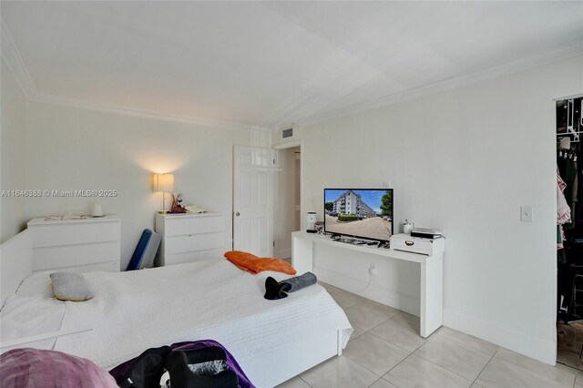 tiled bedroom featuring access to outside and ornamental molding