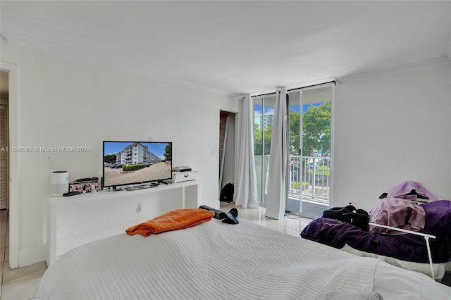 bedroom with light tile patterned floors, access to outside, and ornamental molding