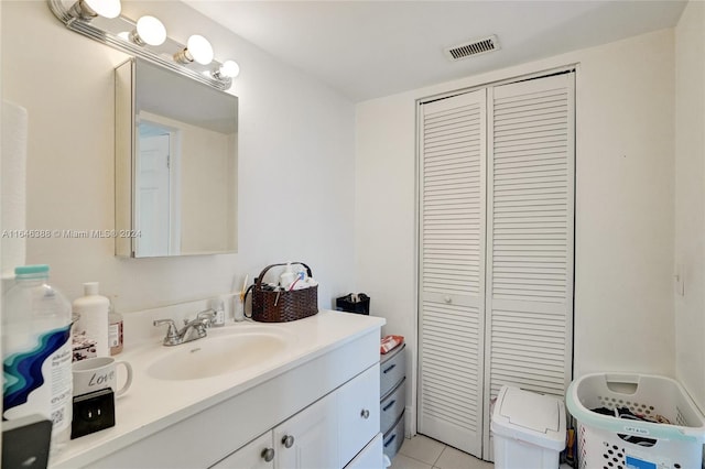 bathroom with tile patterned floors, vanity, and toilet