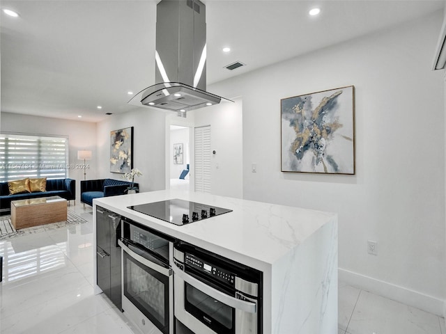 kitchen featuring marble finish floor, island exhaust hood, black electric cooktop, stainless steel oven, and recessed lighting