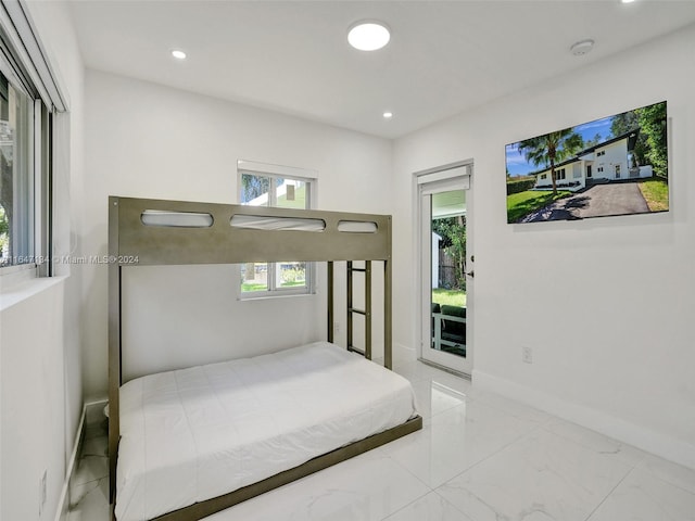 bedroom featuring marble finish floor, multiple windows, recessed lighting, and baseboards