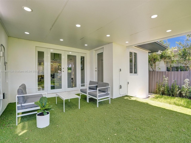 exterior space featuring fence and french doors