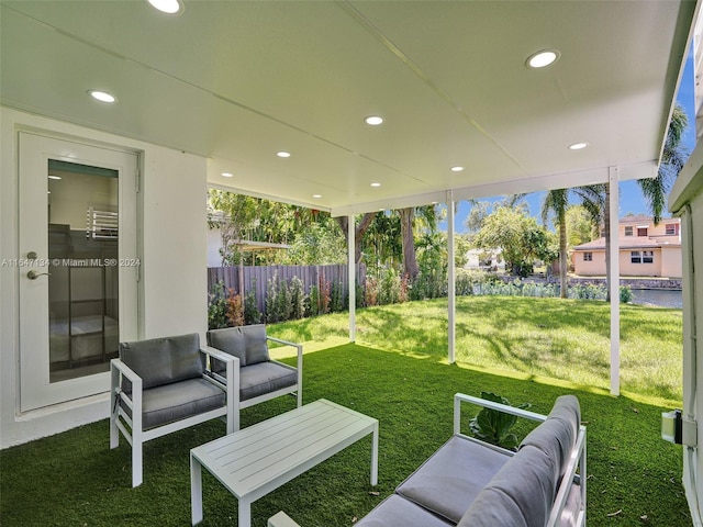 view of yard with fence and an outdoor living space