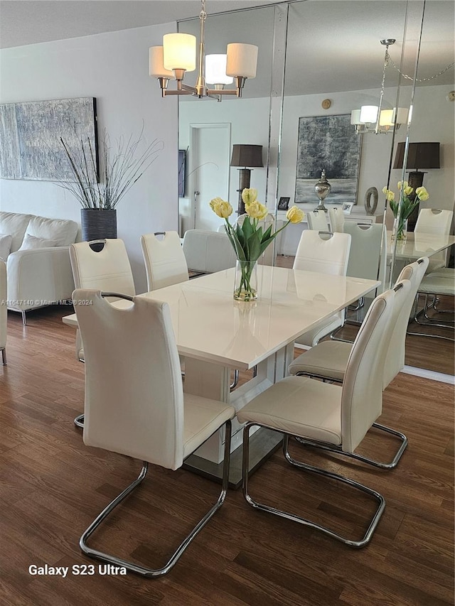 dining area with dark hardwood / wood-style flooring