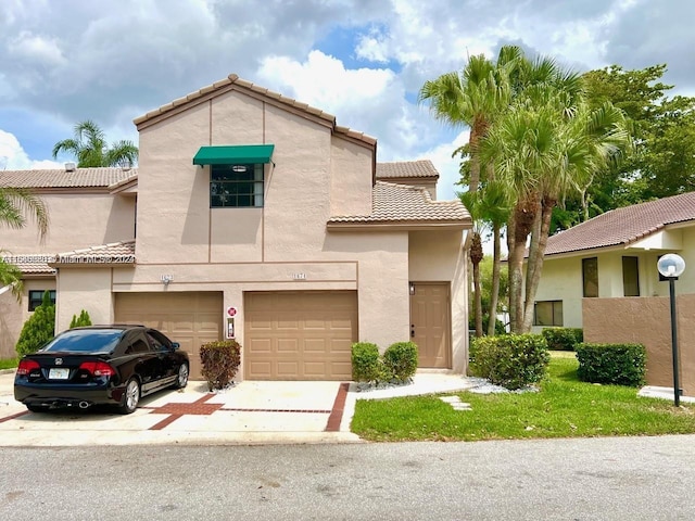 mediterranean / spanish-style house featuring a garage