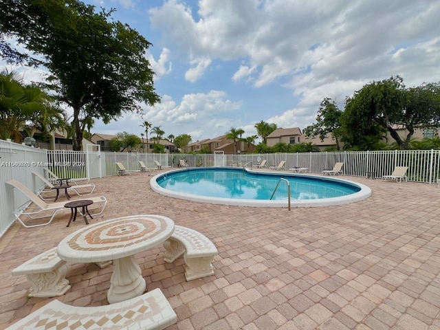 view of pool with a patio area