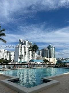 view of pool with a water view